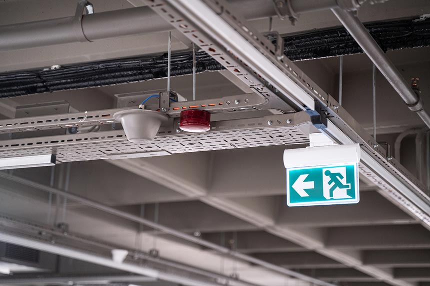 Lighted green exit sign in an industrial building